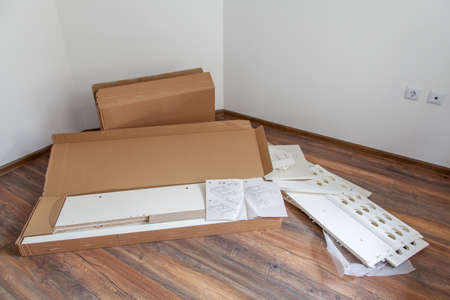 Furniture assembly parts for self assembly furniture, on the floor.の写真素材