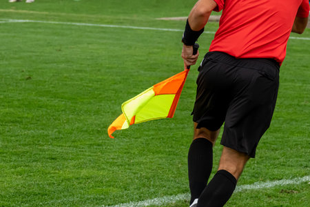 Assistant referees in action during a soccer matchの写真素材