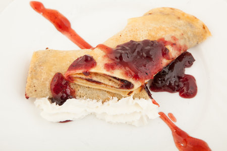 Pancakes with strawberry jam and cream. closeupの写真素材