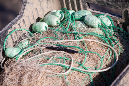 Fishing net with green floatsの写真素材