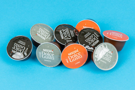 VARNA, BULGARIA - SEPTEMBER 8, 2021: Nescafe Dolce Gusto coffee capsules on blue background.