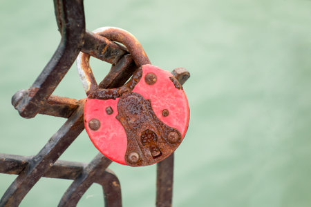 Closeup of a old rusty padlock on the bridgeの写真素材
