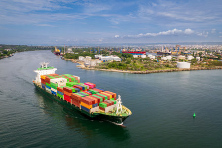 Large container ship leaving port. Aerial view of cargo container ship vessel import export...