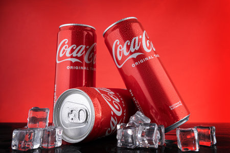 Varna, BULGARIA - APRIL 22, 2024: Close up of classic Coca Cola original taste, red cans with water...