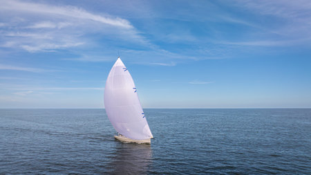 Sailing yacht with white sailの写真素材