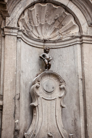 The statue of Manneken pis in bruxelles. Manneken Pis (Little man Pee) or le Petit Julienの写真素材