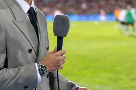 News journalist with microphone interviewingの写真素材