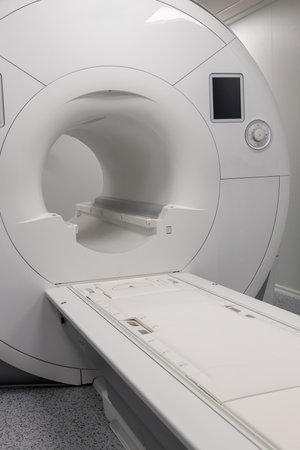 Modern MRI scanner in a hospital room. Advanced medical equipment for Magnetic Resonance Imaging,...