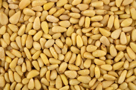 Closeup background texture of organic shelled pine nutsの写真素材