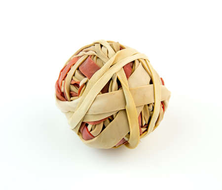Macro of red and brown rubber bands in a ballの写真素材