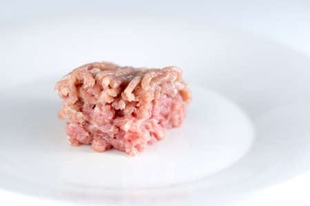 Raw uncooked turkey mince meat isolated on whiteの写真素材