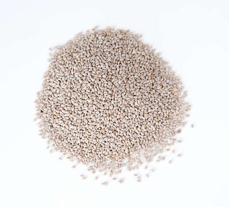 Closeup of pile of chia seeds against whiteの写真素材