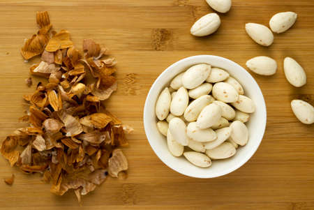 Bowl of almonds that have been soaked in water then skinned.の写真素材