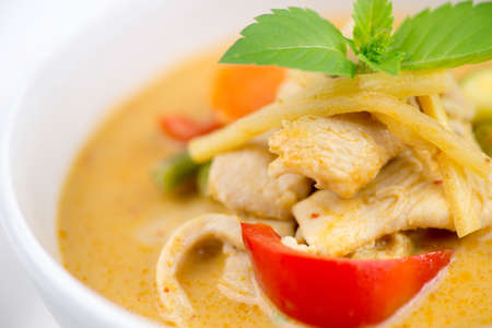 Macro of garnished chicken red curry from Thailand with seasonal vegetablesの写真素材