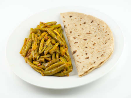 Simple and traditional Indian meal with roti and breen bean curry