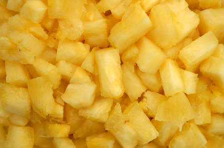 Close up macro shot of juicy chopped pineapples.の写真素材