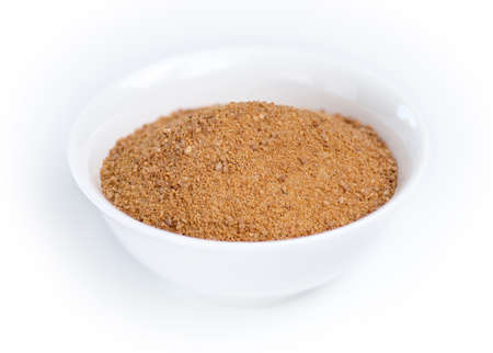 Coconut sugar in a white bowl against whiteの写真素材