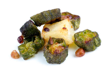 Macro closeup of fried okra with cumin and potato isolated on whiteの写真素材