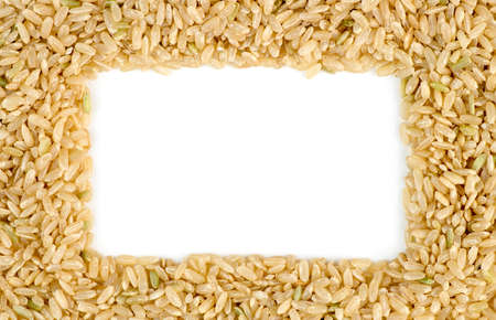 White copyspace surrounded by macro of whole brown rice grainsの写真素材