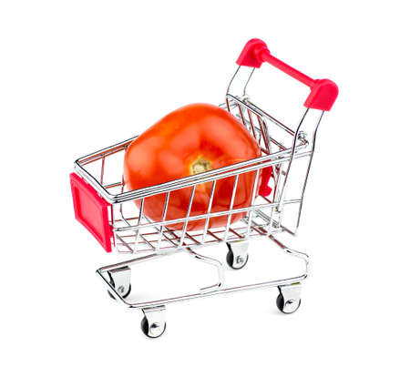 Huge tomato in shopping cartの写真素材