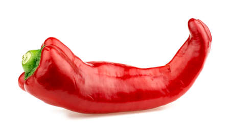 Side macro shot of red bullhorn chili pepper isolated on whiteの写真素材