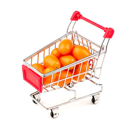 Orange gold grape tomatoes in mini shopping cartの写真素材