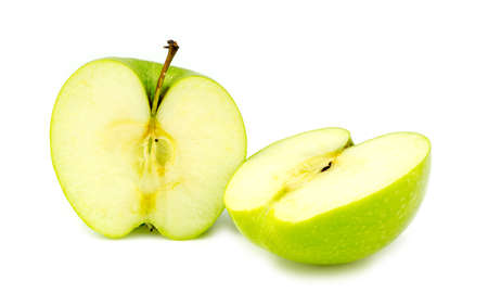 Chopped halves of fresh organic green granny smith appleの写真素材
