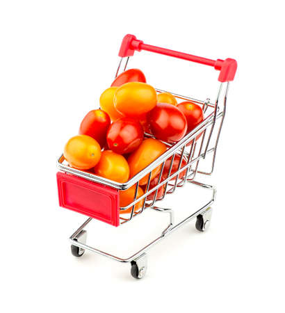 Shopping cart with massive multicolored grape tomatoesの写真素材