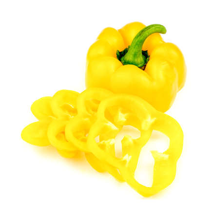 Whole yellow capsicum pepper with sliced cross sectionsの写真素材