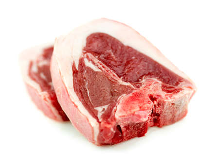 Raw uncooked lamb loin beef chop isolated on white in studioの写真素材