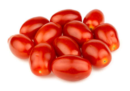 Pile of red grape tomatoes isolated on white in studioの写真素材