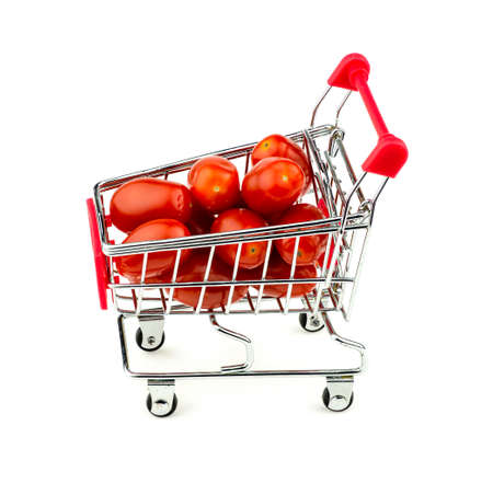 Red grape tomatoes in trolley isolated on whiteの写真素材