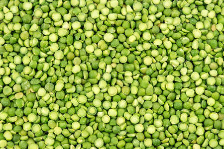 Macro background texture of vibrant green split peasの写真素材