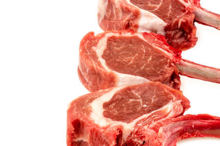 Uncooked lamb chops isolated on whiteの写真素材