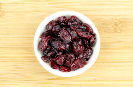 Dehydrated dried cranberries in bowlの写真素材