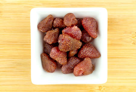 Dried gummy strawberries snack in white bowlの写真素材