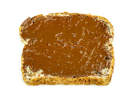 Chocolate hazelnut spread on whole wheat toast isolatedの写真素材