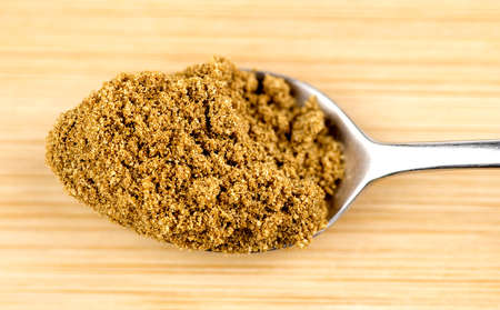 Crushed cumin powder in teaspoonの写真素材