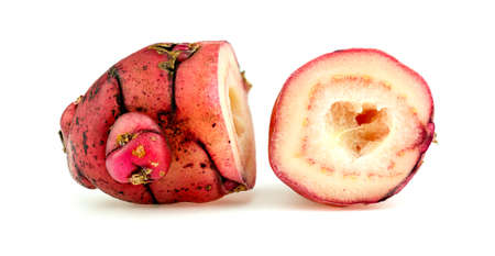 Macro closeup of halved pink oca new zealand yamの写真素材