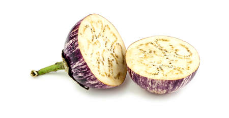Halved thai asian eggplant studio on whiteの写真素材
