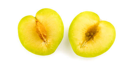 Inside of juicy green plum with seed and coreの写真素材