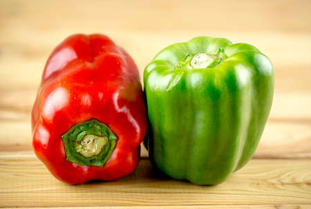 Red and green bell peppersの写真素材