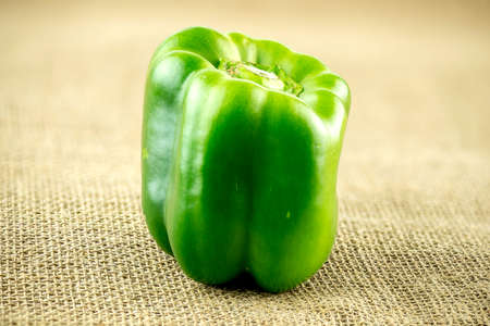 Delicious green pepper on burlap sackの写真素材