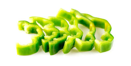 Organic sliced green bell pepper isolated on whiteの写真素材