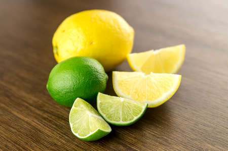Delicious sour citrus fruits against rustic dark oakの写真素材
