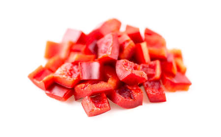 Diced up red bell peppers isolated in studioの写真素材