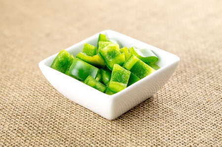 Cut green pepper on organic burlap backgroundの写真素材