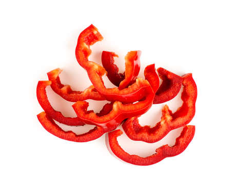 Juicy red bell pepper cut up and isolated on whiteの写真素材