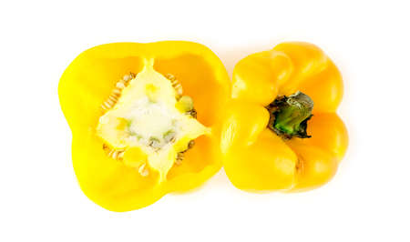 Inside of yellow bell pepper capsicum with seeds and top stem cut offの写真素材