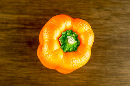 Top view of orange bell pepper with crinkled skinの写真素材